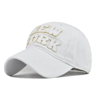Detail of white cotton baseball cap featuring vintage 3D New York patch embroidery