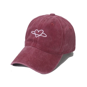 Vintage burgundy washed cotton baseball cap with white heart embroidery and curved brim