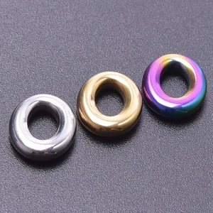 Polished stainless steel oval ring accessories in silver, gold, and rainbow finishes