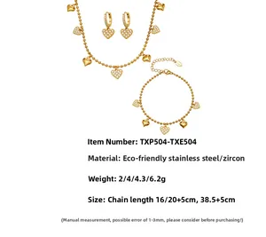 Detail of gold-plated stainless steel jewelry set with heart charms and pavé zircon stones