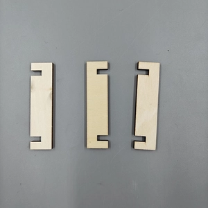 Detail showing the grooved wooden slots and DIY assembly components of the Christmas tree rack