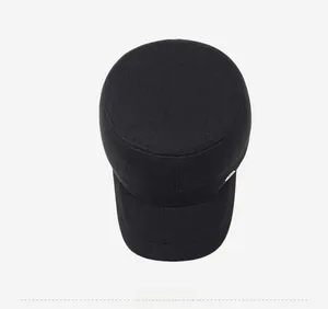 Top view of a thick black flat top military style winter hat with fine twill texture