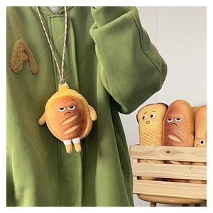Petit sac en peluche forme baguette avec visage grincheux et cordon pratique