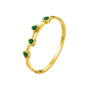 Gold plated titanium steel bangle featuring four green heart-shaped zircon stones