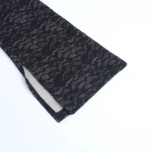 Close-up of the delicate floral lace pattern and high-quality edge slit detail