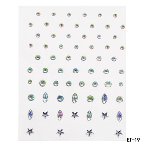 Macro detail of AB iridescent acrylic rhinestones in star and round shapes for DIY face makeup