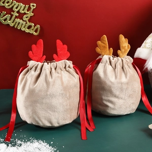 Plush Christmas reindeer antler drawstring gift bags in beige with red velvet ribbons