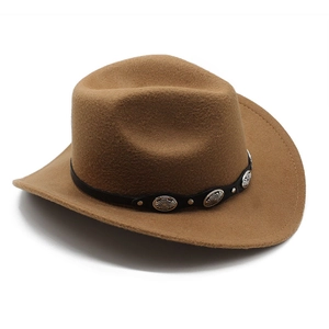 Detail of brown wool cowboy hat with leather band and vintage silver studded rivets