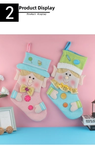 Detail of pink and blue knitted Christmas elf stockings with 3D bows and cute candy patches
