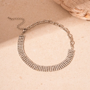 Detailed macro view of silver rhinestone choker with chunky chain and adjustable clasp