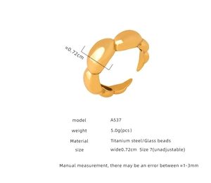 Detail view of gold titanium steel bubble ring with specifications and 0.72cm width