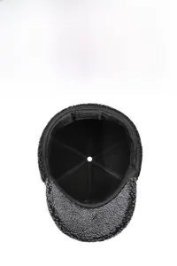 Detail view of the warm interior lining and 6-panel stitching of the winter wool cap