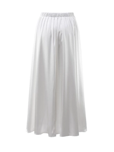Detailed view of elastic high waist pleats on elegant white satin maxi skirt fabric