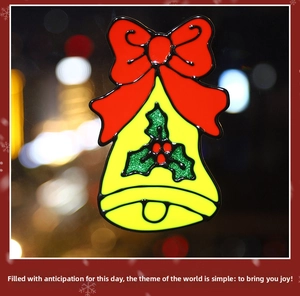 Détail d'autocollant de Noël en forme de cloche avec nœud rouge pour vitrine