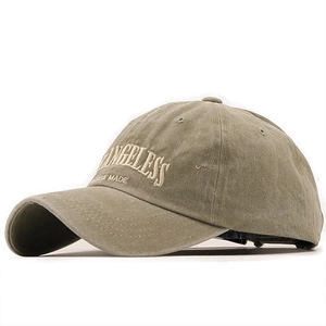 Vintage washed olive green baseball cap with embroidered lettering and a curved brim