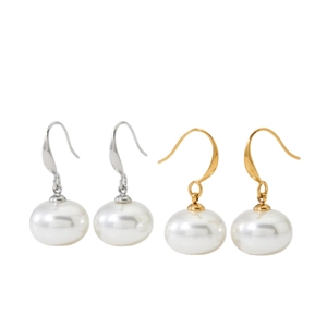 Elegant pearl drop earrings with gold and silver hooks on a minimalist white background