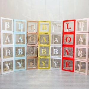 Detailed view of colorful transparent balloon boxes with BABY and LOVE lettering
