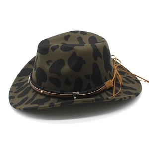 Detail of dark olive wide brim cowboy hat with cow print texture and leather band