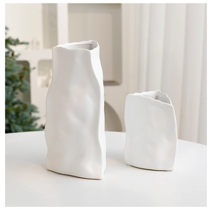 Artistic matte white ceramic vase with unique paper-bag texture for Christmas home decor