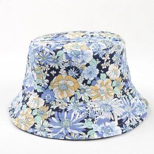 Close-up of vibrant blue and yellow floral pattern on high-quality cotton bucket hat fabric