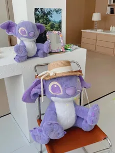 Detail of Stitch plush toy with straw hat on leather chair in a cozy room setting