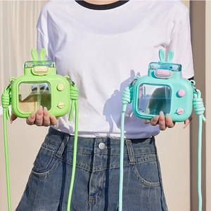 Detail of camera-shaped water bottles with cute rabbit ear lids and adjustable straps