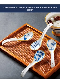 Detail of blue and white ceramic spoons with hooked handles on a woven tray
