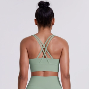 Detail view of the criss-cross back straps on a gray-green brushed sports bra