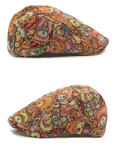 Detail of bear jacquard pattern and bronze metal adjustable buckle on retro beret hat