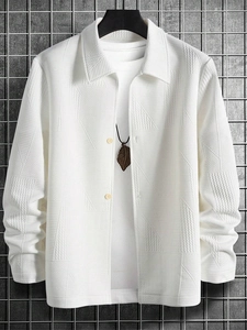 Detailed view of white jacket featuring unique geometric embossed textures and polo collar