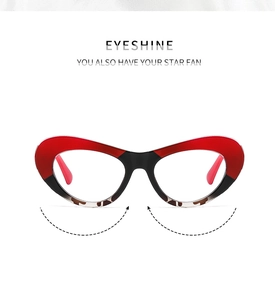 Detailed front view of red and black cat-eye glasses frame with bicolored artistic design