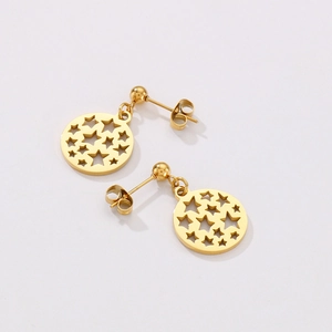 Flat lay of gold stainless steel earring set featuring hollow circle star pendants
