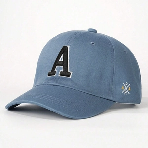 Close-up of black letter A embroidery with white outline on blue cotton baseball cap