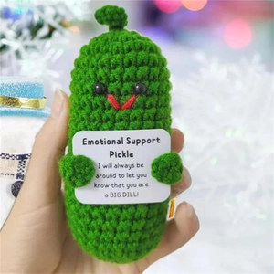 Handmade crochet positive energy cucumber doll with motivational card held in hand