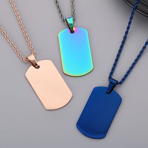 Polished stainless steel dog tag necklaces in rose gold, rainbow, and blue on twist chains