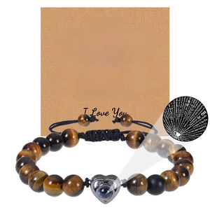 Tiger eye bead bracelet with heart projection stone shown on a kraft gift card