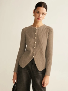 Detailed view of the ribbed knit cardigan texture and eight golden spherical buttons