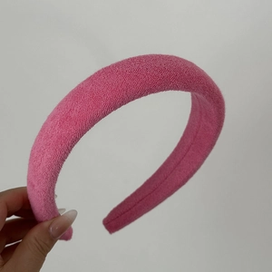 Close-up of soft pink towel fabric headband with thick sponge texture detail