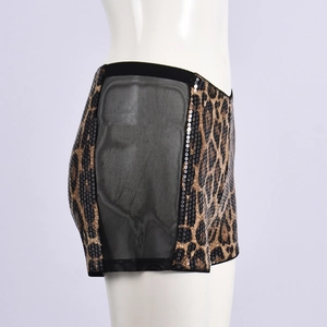 Detail of sequined leopard print shorts with black mesh side panels on mannequin