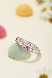 Detail view of S925 silver ring featuring multi-colored zircon stones in eternity setting