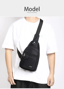Detail of black waterproof oxford chest bag with multiple zippers and headphone jack port