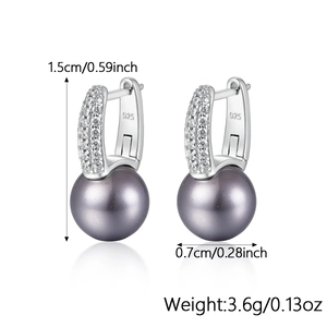 Detail view of S925 silver pearl stud earrings with sparkling diamonds and 925 hallmark
