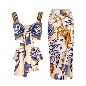 Ethnic blue and gold print two-piece set with tie-up crop top and high-waisted wrap skirt