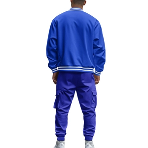 Rear view of men's blue varsity baseball jacket and matching cargo pants set