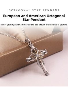 Detail of cross pendant featuring a golden star and sparkling zircon embellishments