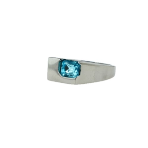 Silver stainless steel ring with a rectangular light blue zircon stone on white background