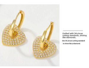 Macro detail of heart hoop earring with 5A grade cubic zirconia and gold plating