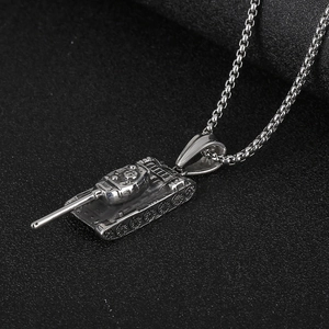 Vintage stainless steel tank pendant necklace with box chain on a textured black background
