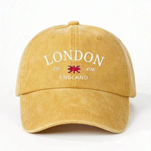 Close-up of vintage mustard washed cotton baseball cap with London England embroidery
