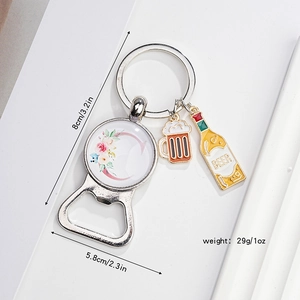 Detailed view of metal beer bottle opener keychain with alphabet C and floral motifs